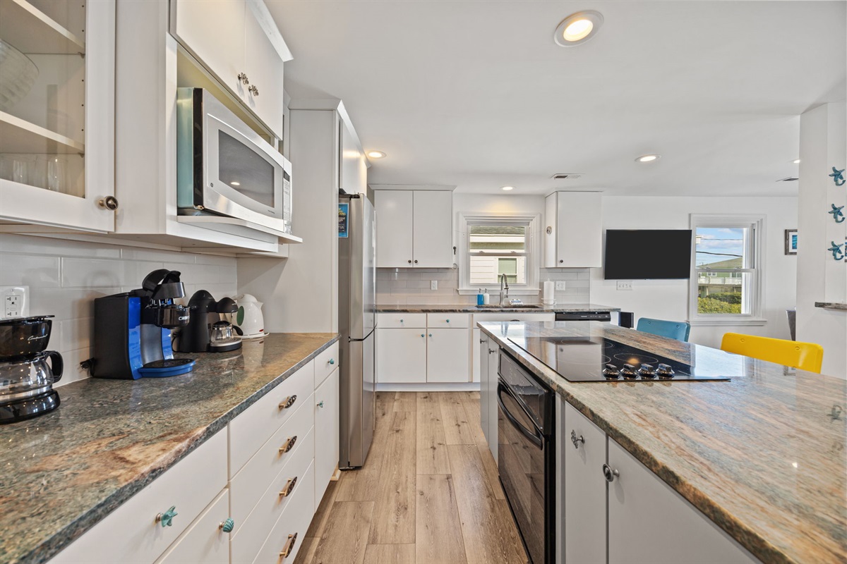 Stainless appliances, ample counters, and everything needed for easy home-cooked meals
