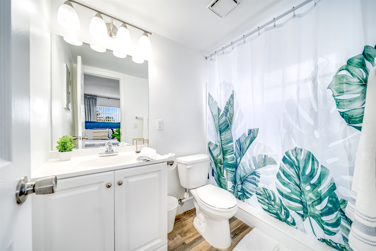 Vanity mirror in the bathroom plus a shower and bathtub