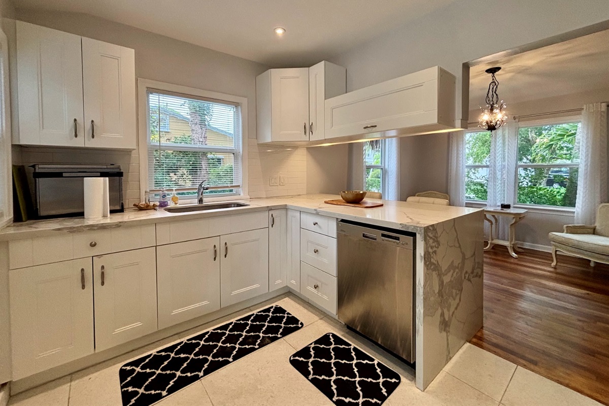 The modern, updated kitchen has all the essentials to make your meals for everyone to enjoy.