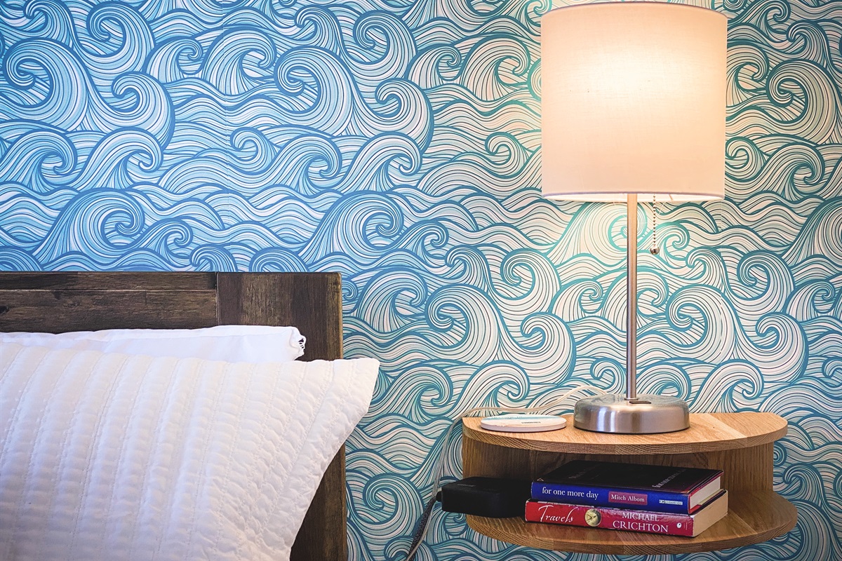 [Bedroom] Curl up in bed with your favorite book/recharge your devices on the floating night stands beside the bed. Each bedroom has nightstands by the bed to put away your devices, bottle of water or book(s), so that everything is within an arm's reach.
