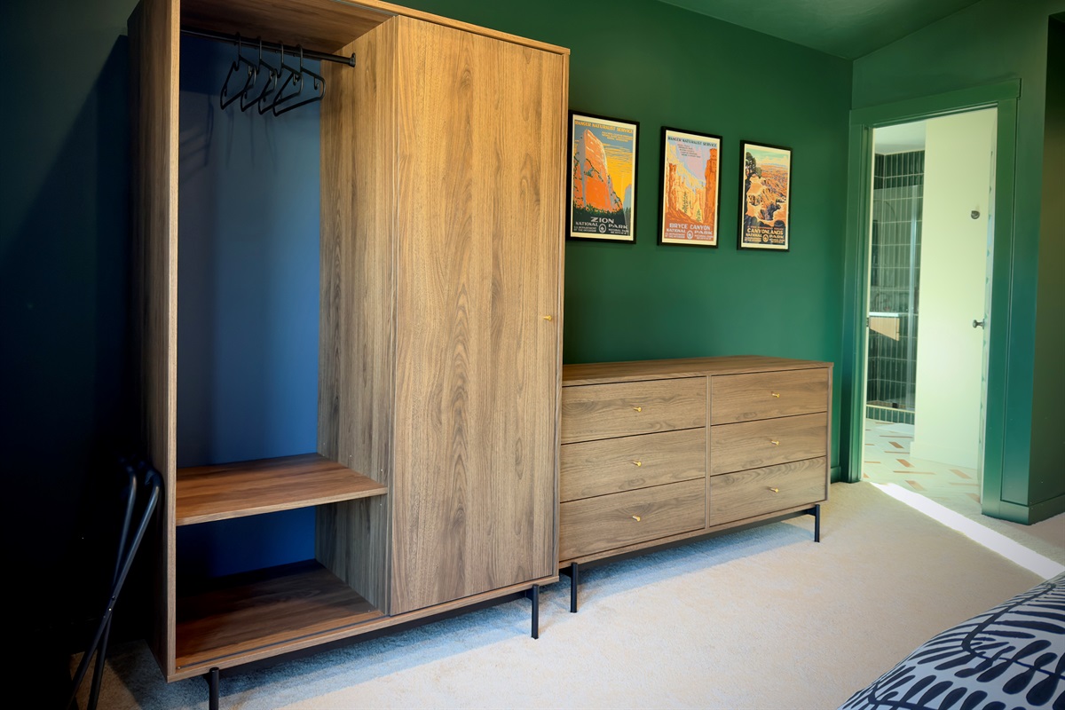 Elegant primary bedroom with dresser storage and ensuite access — the perfect mix of comfort and convenience.