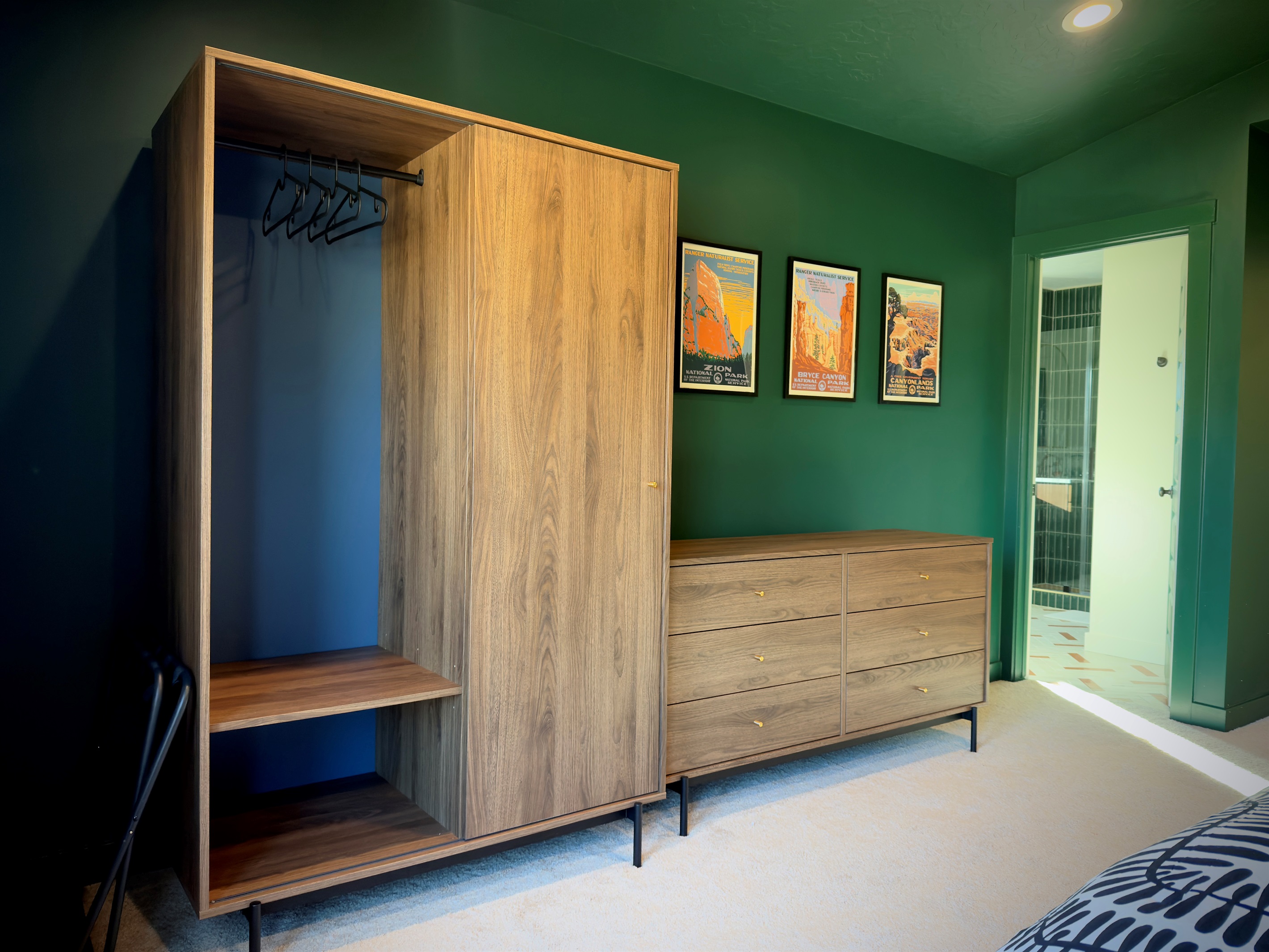 Elegant primary bedroom with dresser storage and ensuite access — the perfect mix of comfort and convenience.