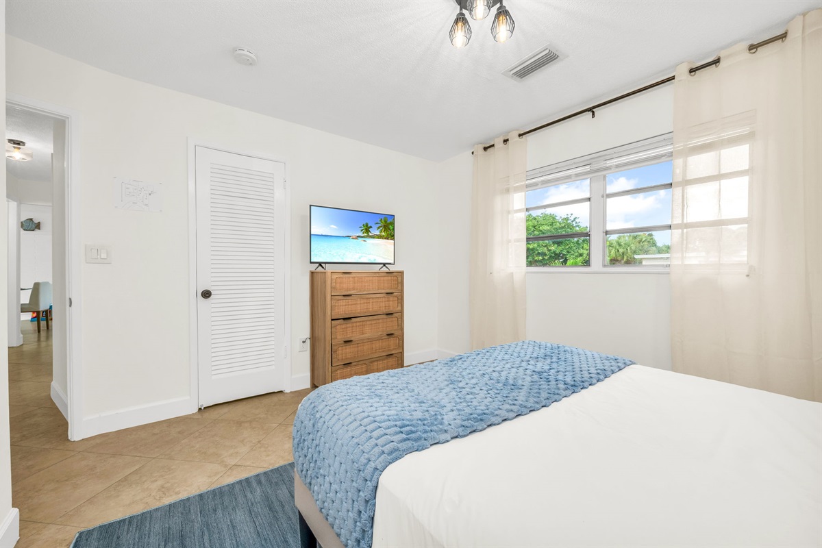 3rd Bedroom: Relax in this stylish queen bedroom with a comfortable queen bed, chic modern accents, and thoughtfully curated décor. The room is designed for comfort and convenience,  offering.