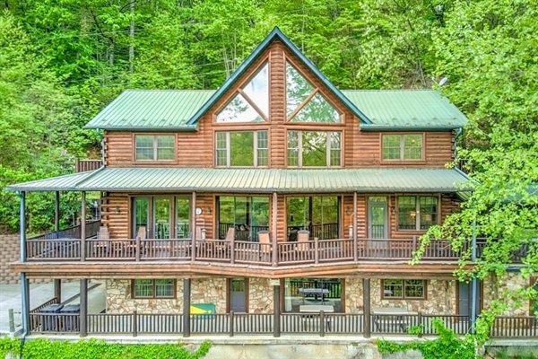 Log cabin perched on a peaceful mountain ridge with views of the river below