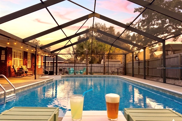 Relax and soak up the sunsets with a cold beverages in Polywood chaise lounges next to the gorgeous, screened-in, and the heated (year round) pool. Cheers!!