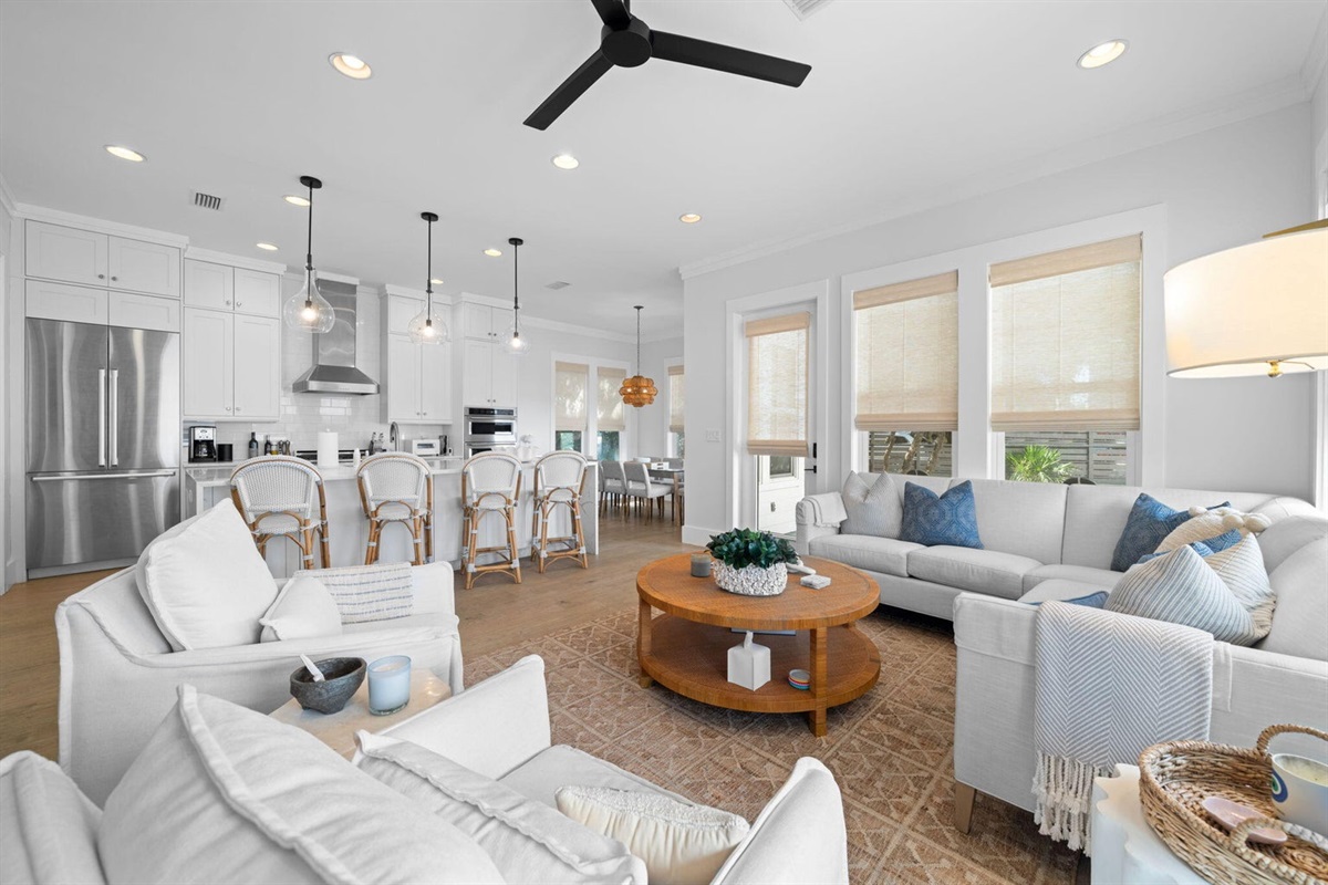 Open living room offers a sectional, two swivel armchairs, and two additional chairs (newly added and not yet pictured!).