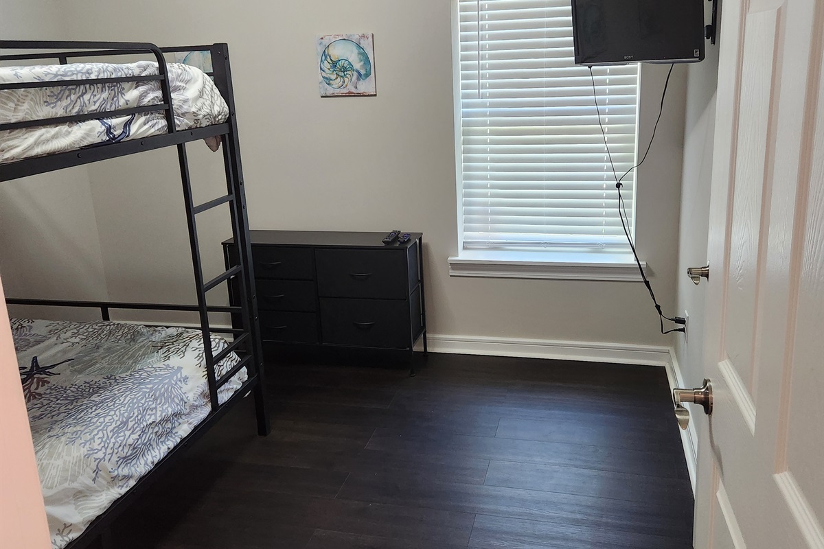 This charming bunk room offers a clean, efficient layout ideal for travel groups or families