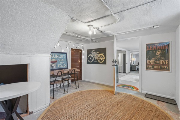 The entry to the Cave Den studio is on the lower level, in a shared area with access to laundry.