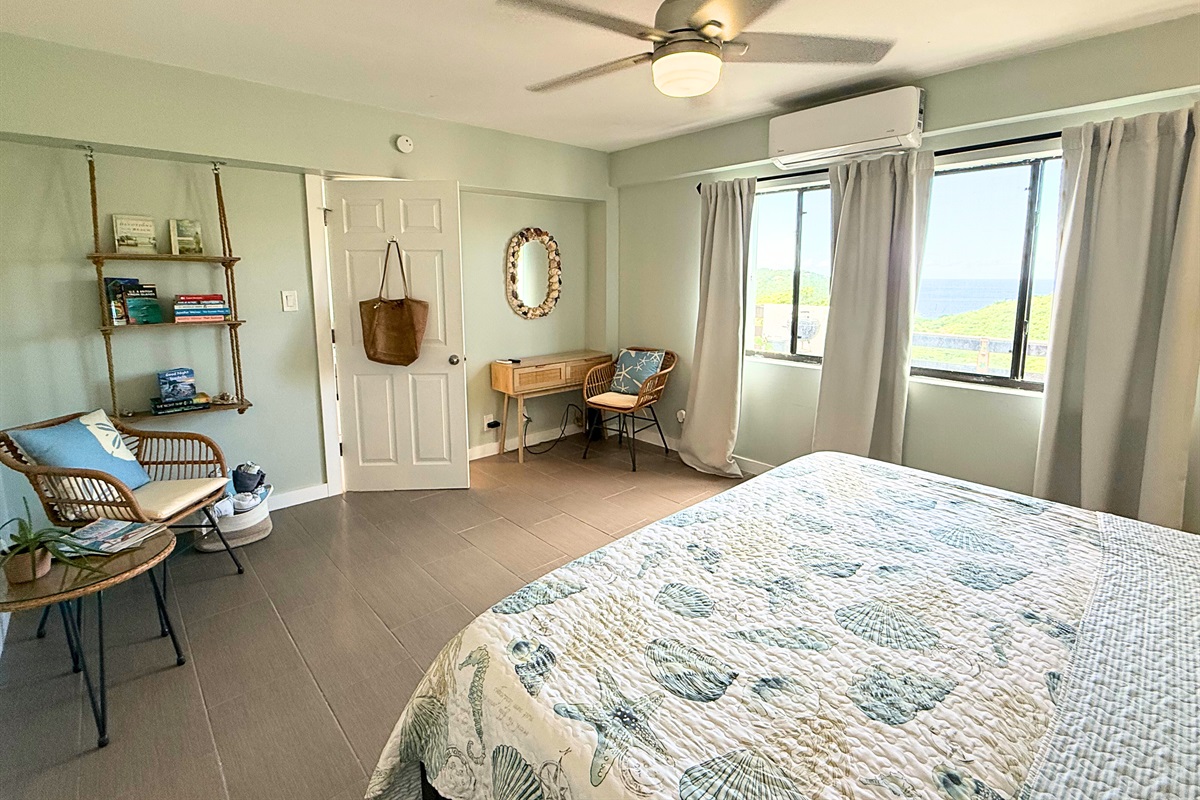 Primary suite has ceiling fan, sitting area, walk-in closet and ensuite bathroom