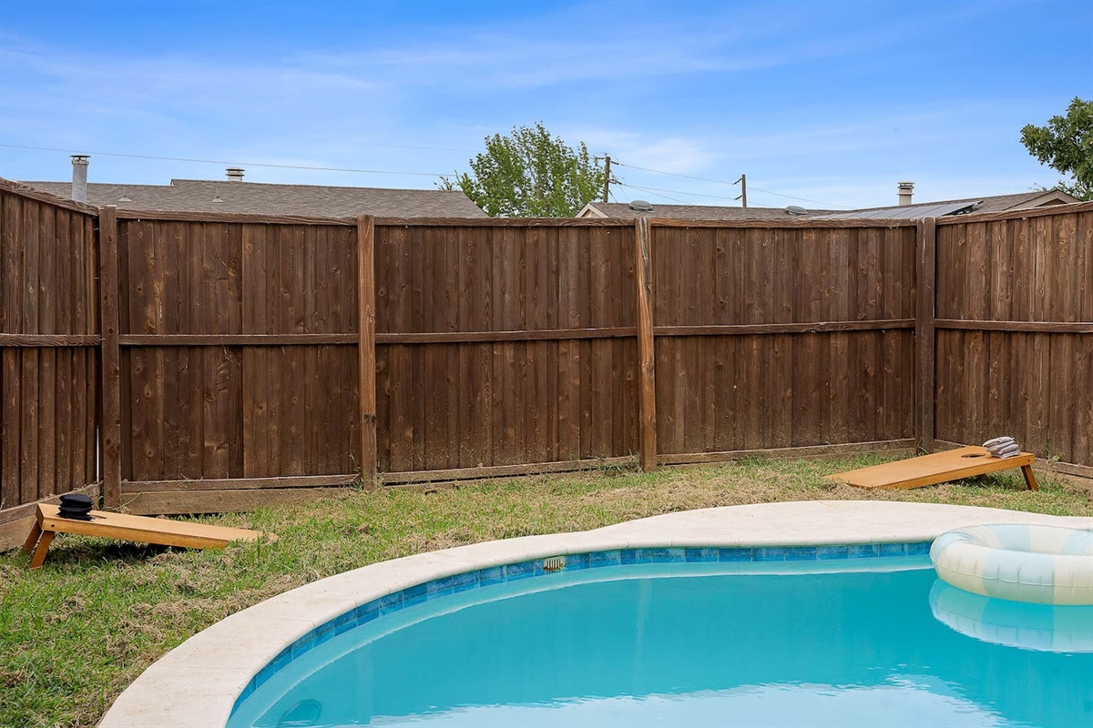 Play a game of cornhole by the poolside for entertainment value that appeals to all age groups. The arrangement improves the external appeal.