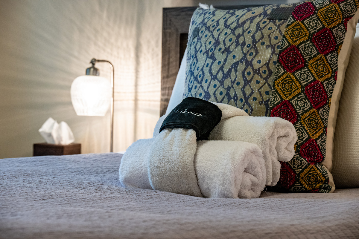 Premium linens and fresh towels await, adding a thoughtful touch to your stay.