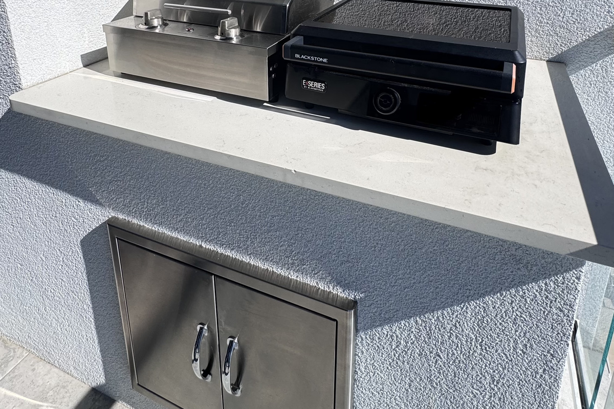 There is an electric grill and a travel-size Blackstone griddle on the balcony, so you do not have to go down to the common area to use the propane grills.