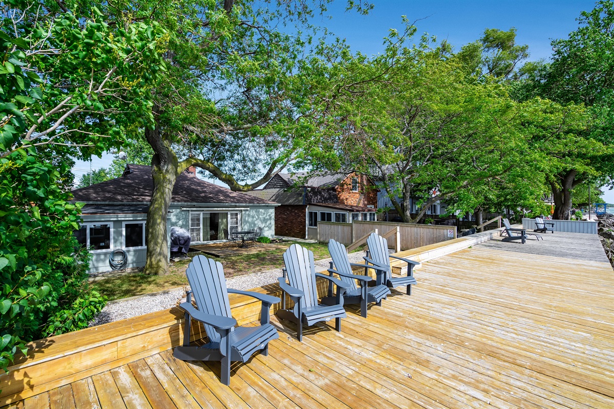 Water's edge deck with muskoka chairs