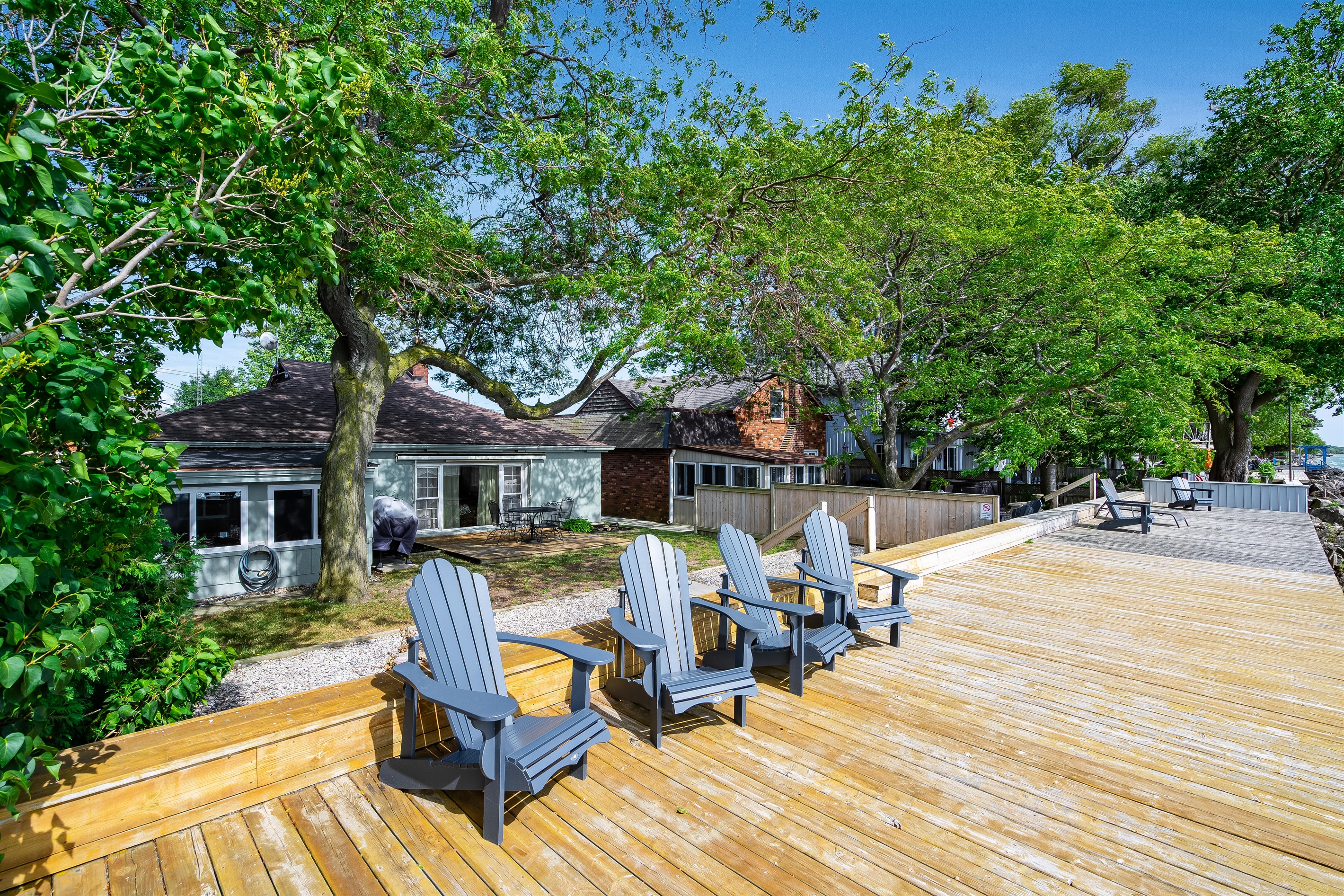 Water's edge deck with muskoka chairs