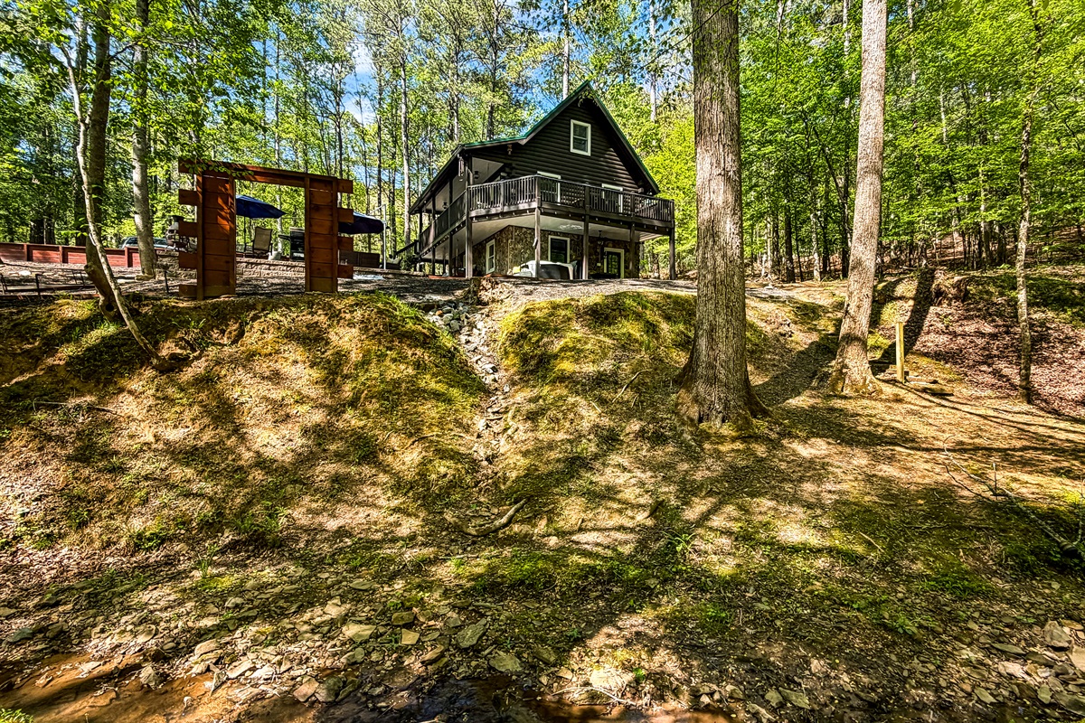 A serene waterfront retreat with stream views. Perfect for rest, restoration, and meaningful moments.