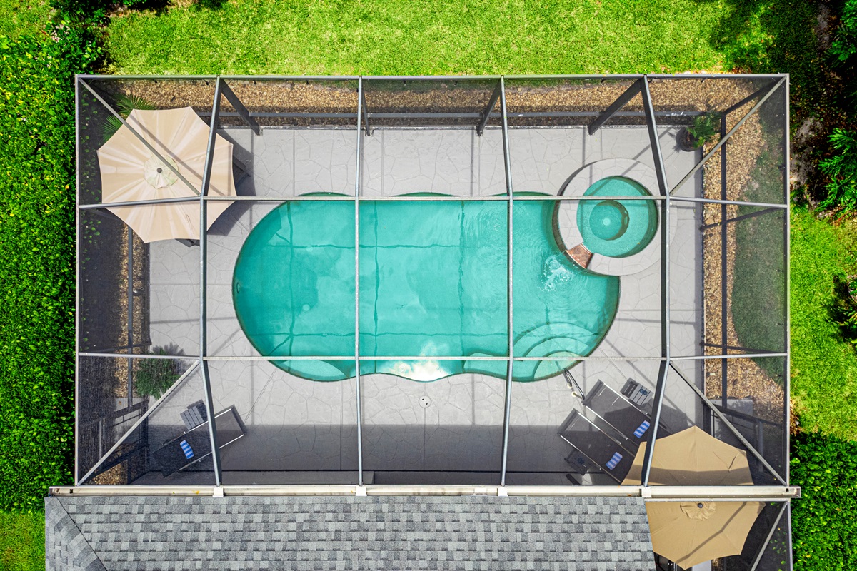 This isn’t your average backyard—it’s a fully enclosed Florida paradise