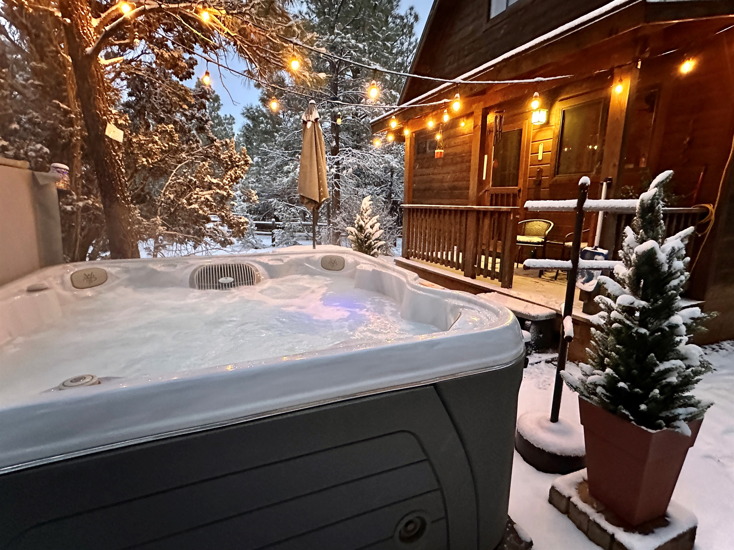 Escape to this cozy cabin in the white mountains and enjoy your own private hot tub under the stars!
