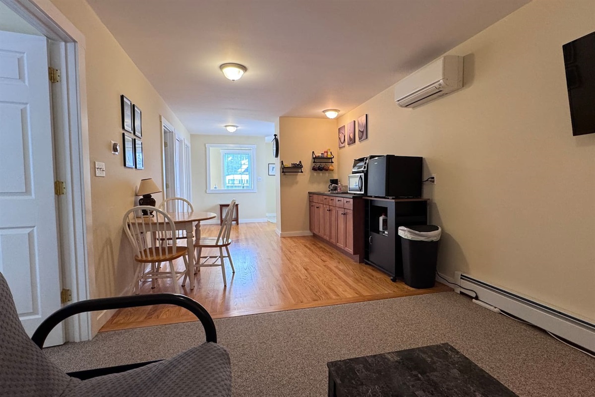 Open concept with Kitchenette, Living room, and dining area with both bedrooms and bathrooms off of the space