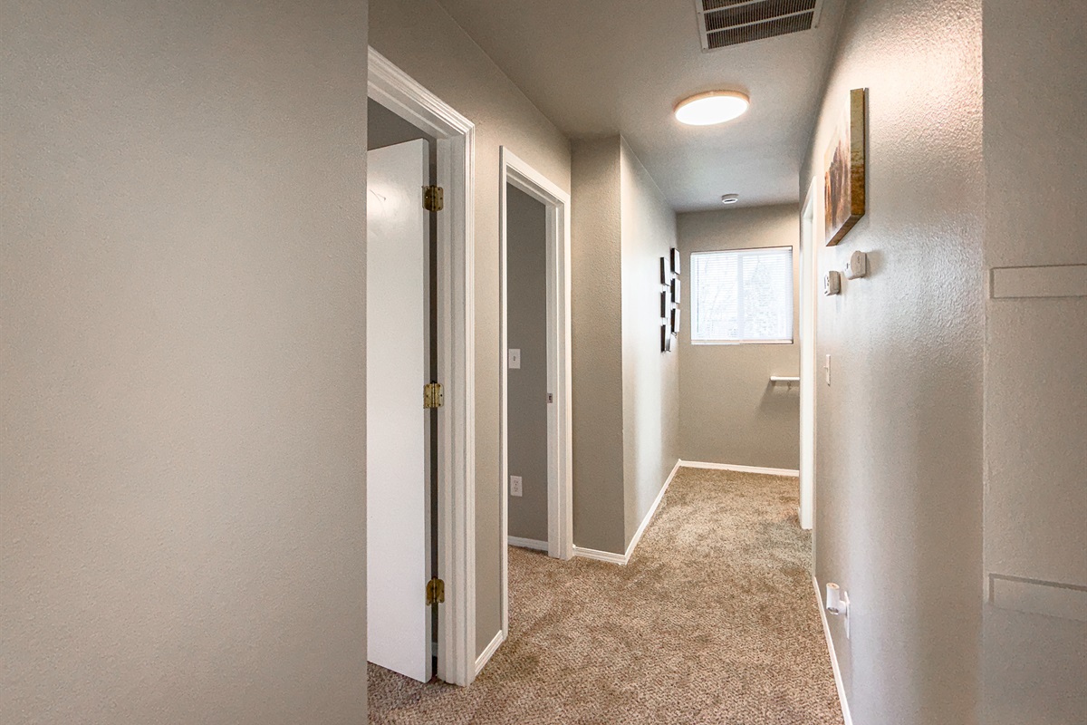 3006 Regan – Hallway connecting bedrooms and bathrooms.
