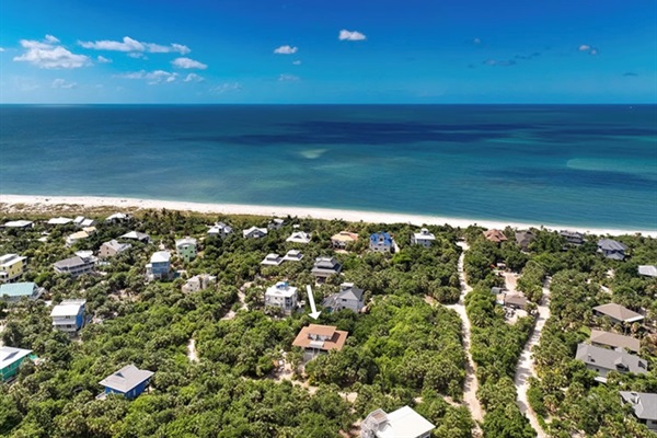 Beach access is effortless: just a quick one minute golf cart ride or a three minute scenic walk