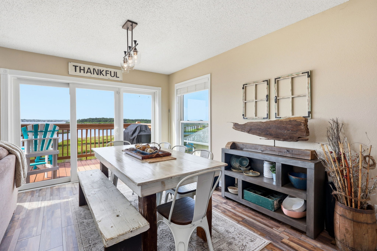 Enjoy indoor dining with a coastal view and easy access to outdoor grilling.