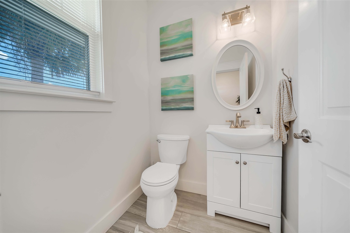 Half Bath right upon entry where you will find complimentary hand soap and basic toiletries waiting for you on the counter.