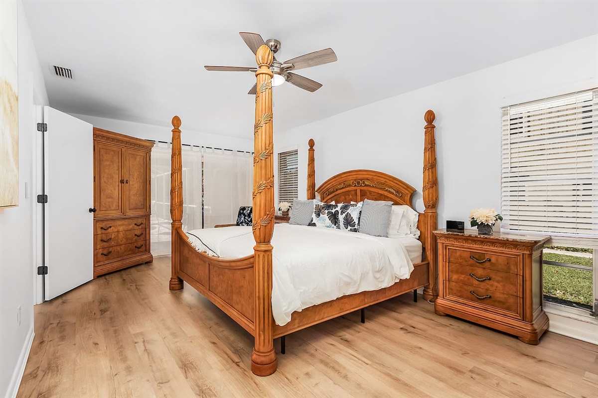 Relax in the primary bedroom (King-size), complete with a TV and direct access to the lanai and pool area for seamless indoor-outdoor living!