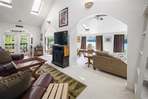House living room with leather couches and tv