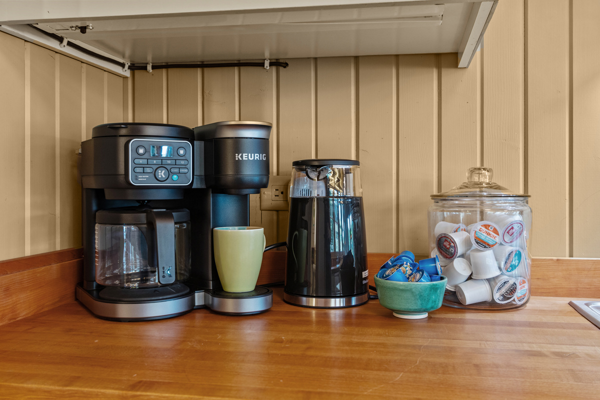 Slow mornings are easy here—brew a fresh pot, grab a Keurig pod, or heat up the electric kettle and enjoy your favorite drink while taking in the peaceful lake setting.