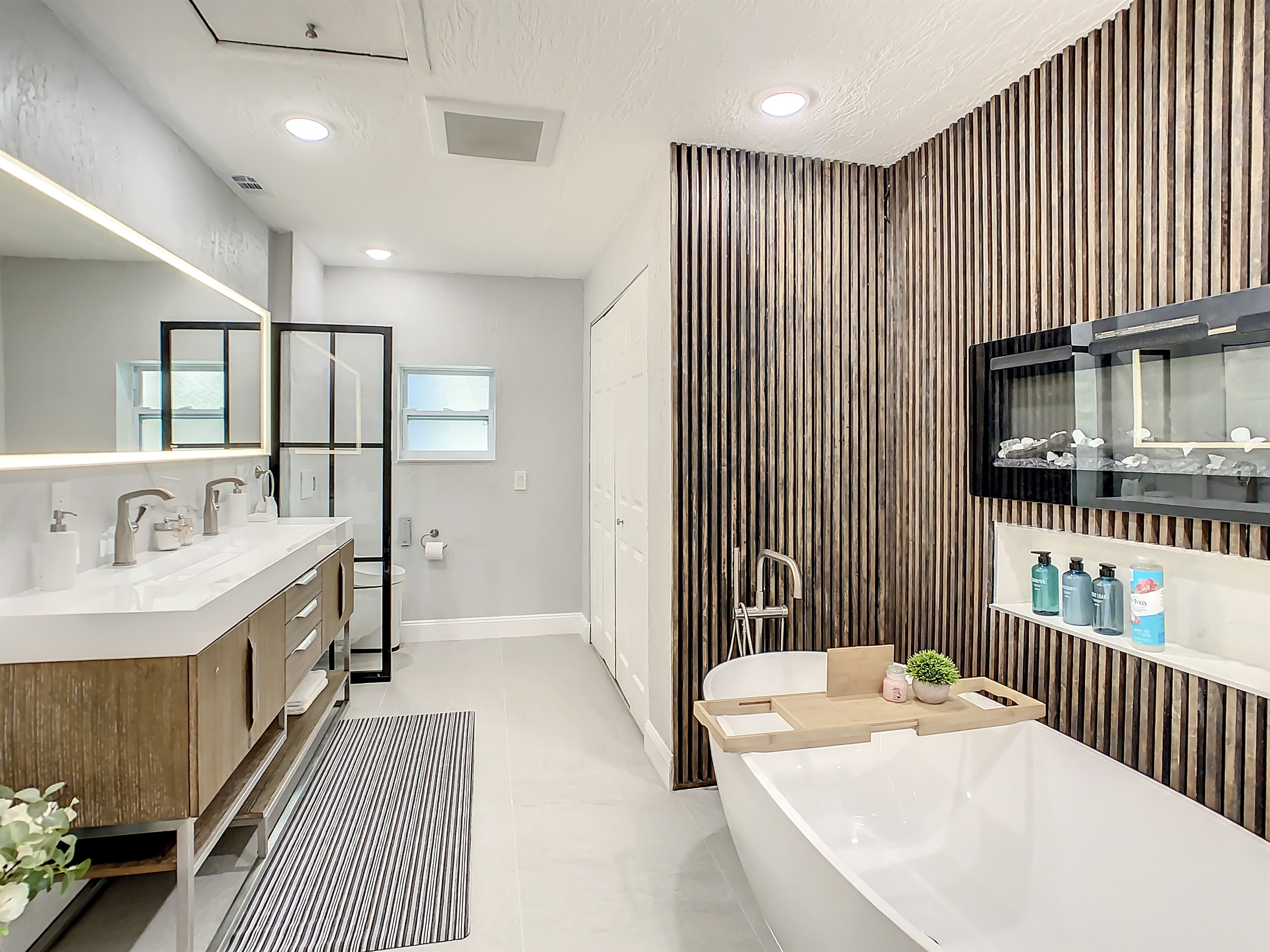 Master bath with duvet and fireplace