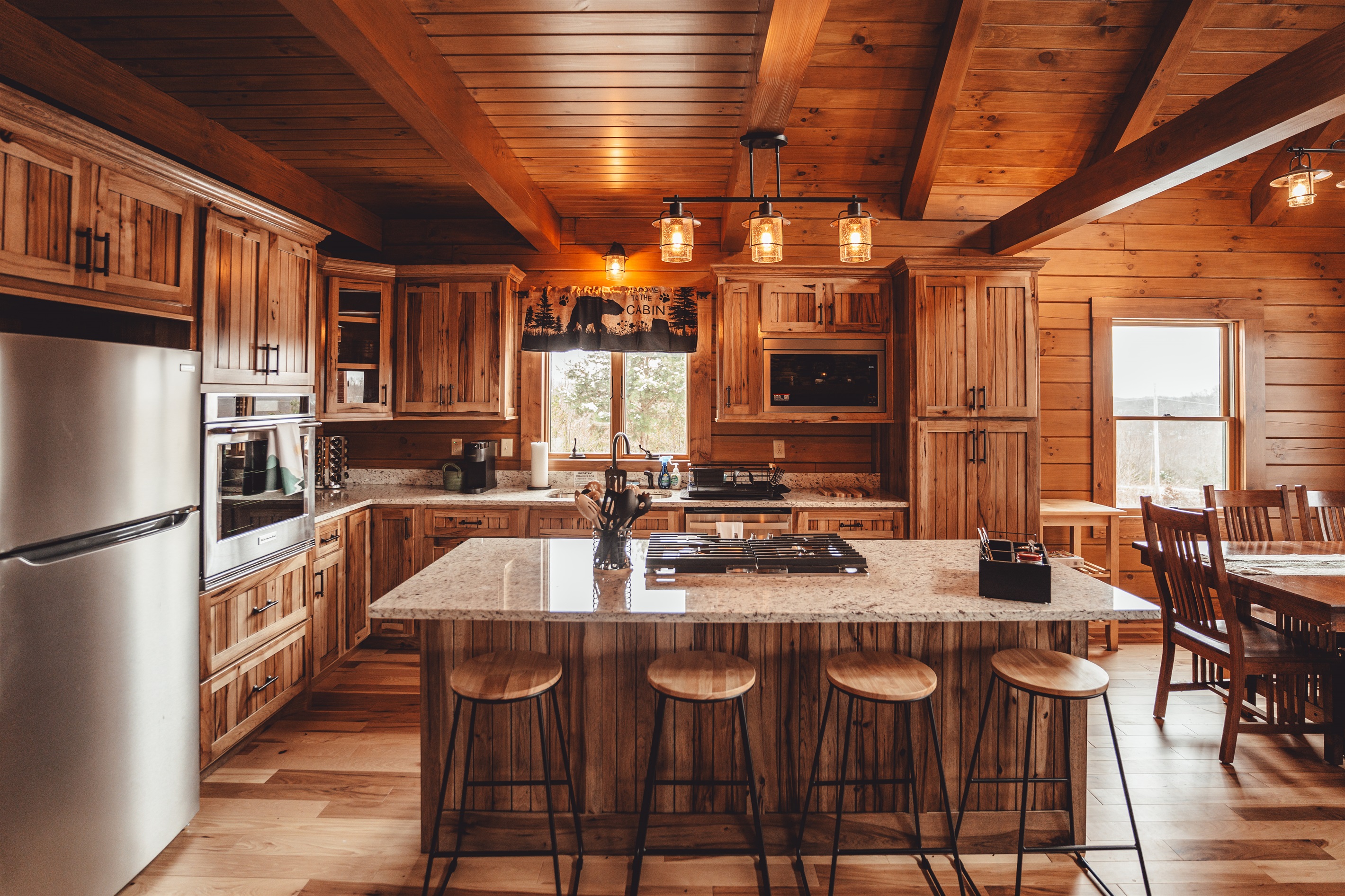 Beautifully Designed Kitchen with Granite Counters, Stainless Steel Appliances, and Gas Stove