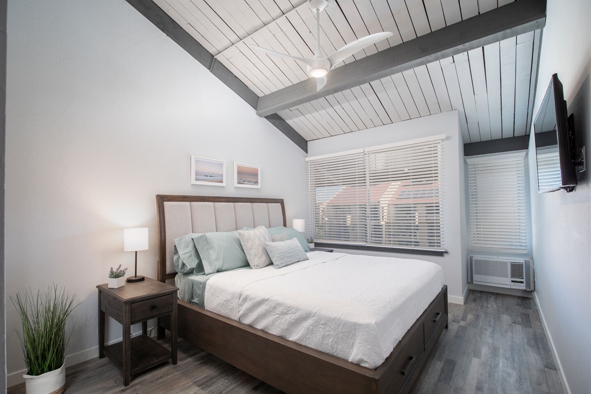 Master Bedroom Upstairs with AC in window. Cal-king Bed