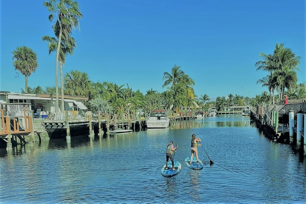 Our back yard, on the "Bahama Canal". |Take a paddle board and a friend to explore the "venetian like" canals of South Florida. 