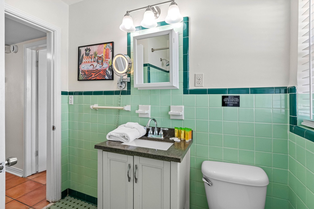 With its signature mint-green tilework, period details, and updated essentials, this space offers both character and convenience for your daily routine.