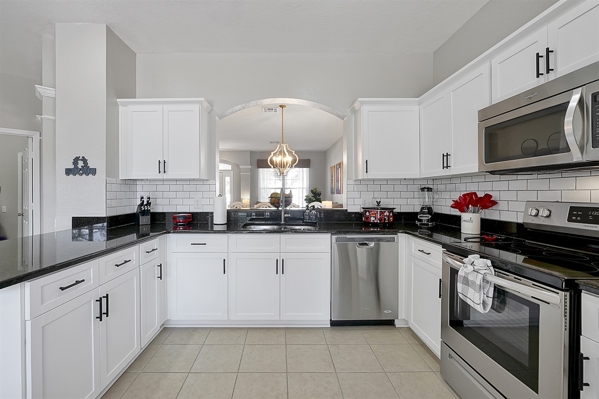 The spacious and fully equipped kitchen makes prepping and cooking meals a breeze.