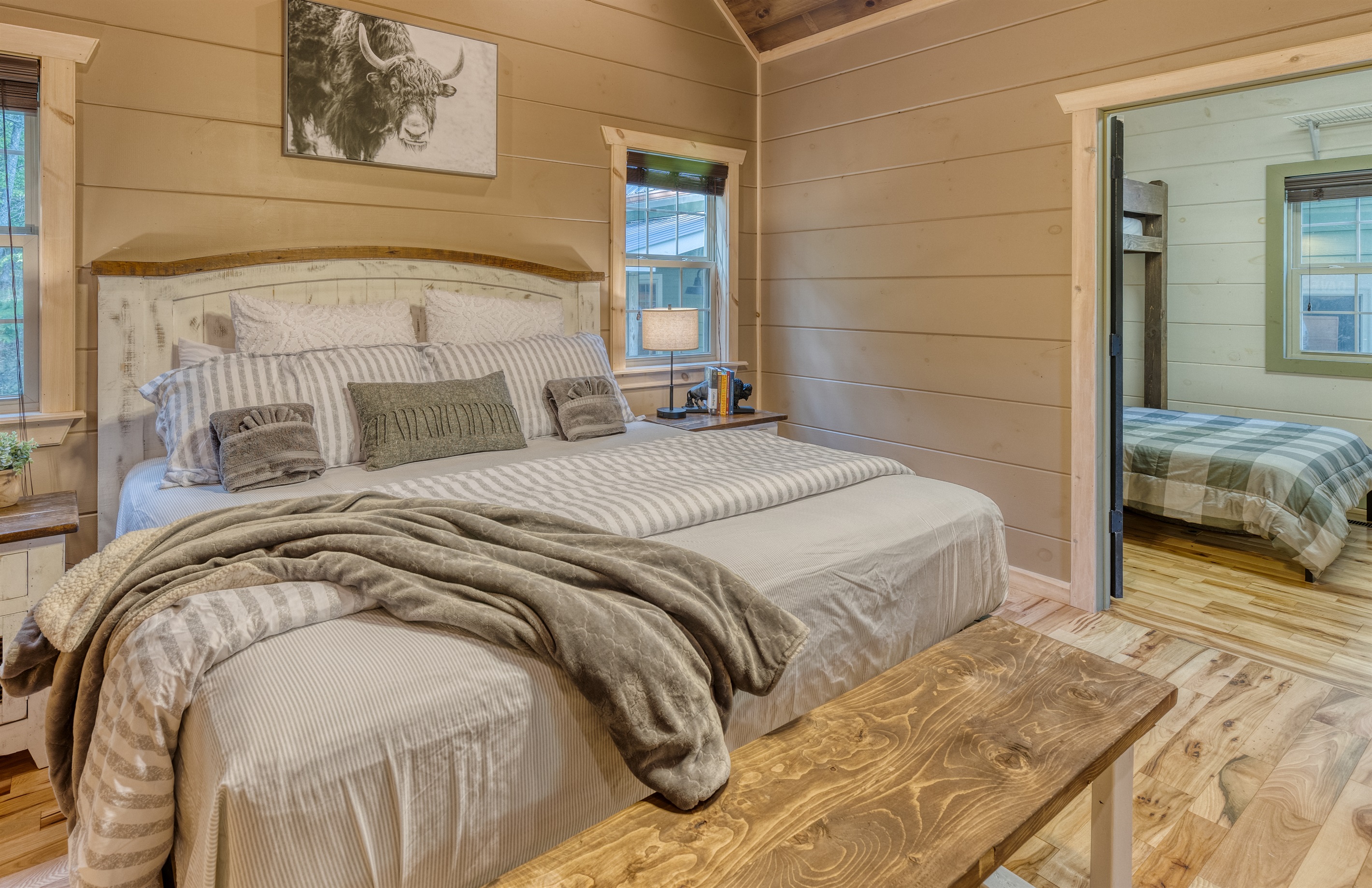 Main floor king en-suite with smart TV and adjoining snooze room - great for kids who need to be close to mom and dad.