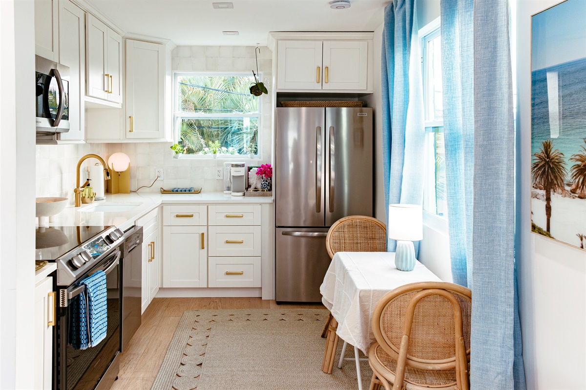 The full kitchen in the cottage has all the cookware and amenities you need to craft tasty meals together.