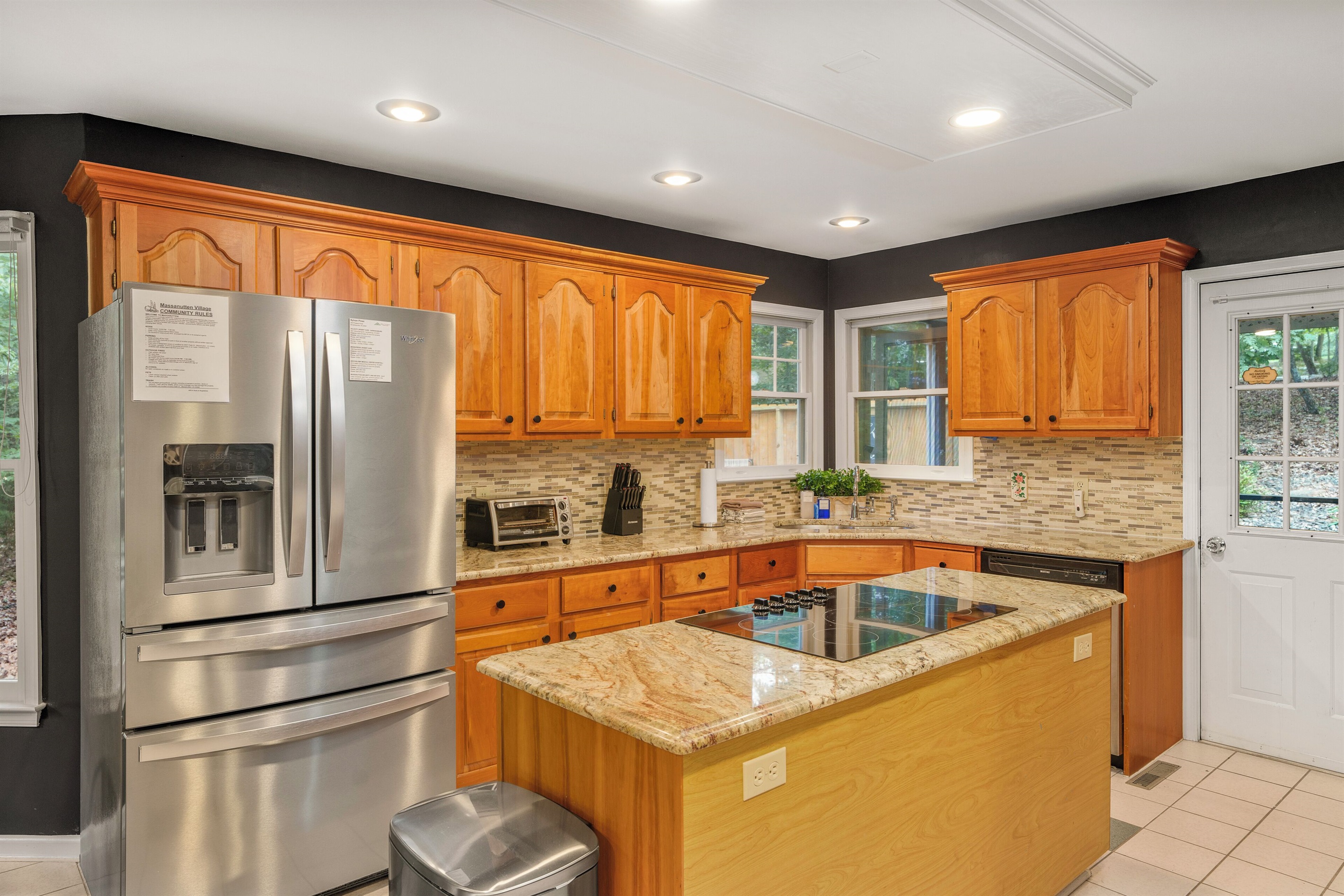 Fully stocked kitchen with stainless appliances
