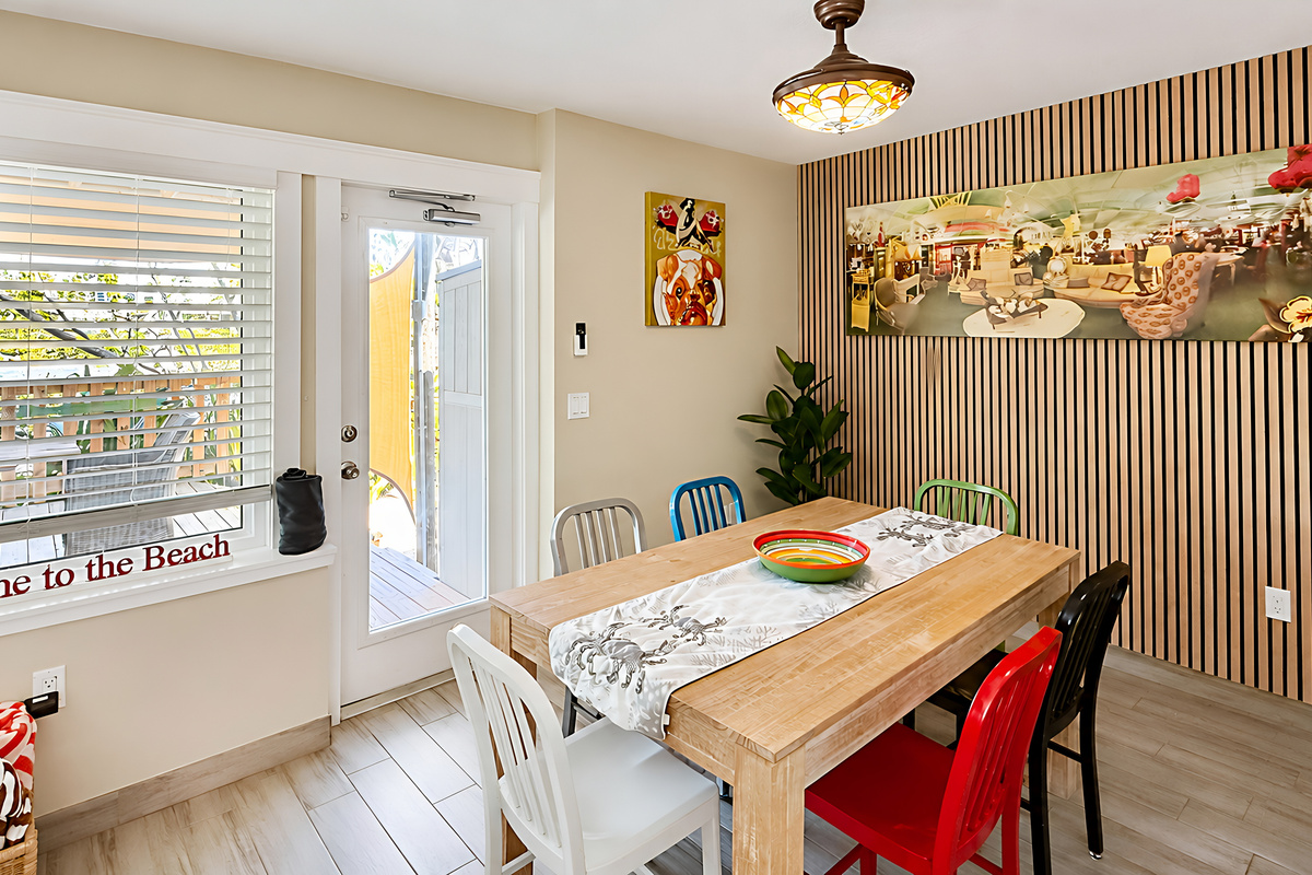 Dining Room of Manatee Suite at AMI Beach Lagoon with View to the Pergola and Vista Lake