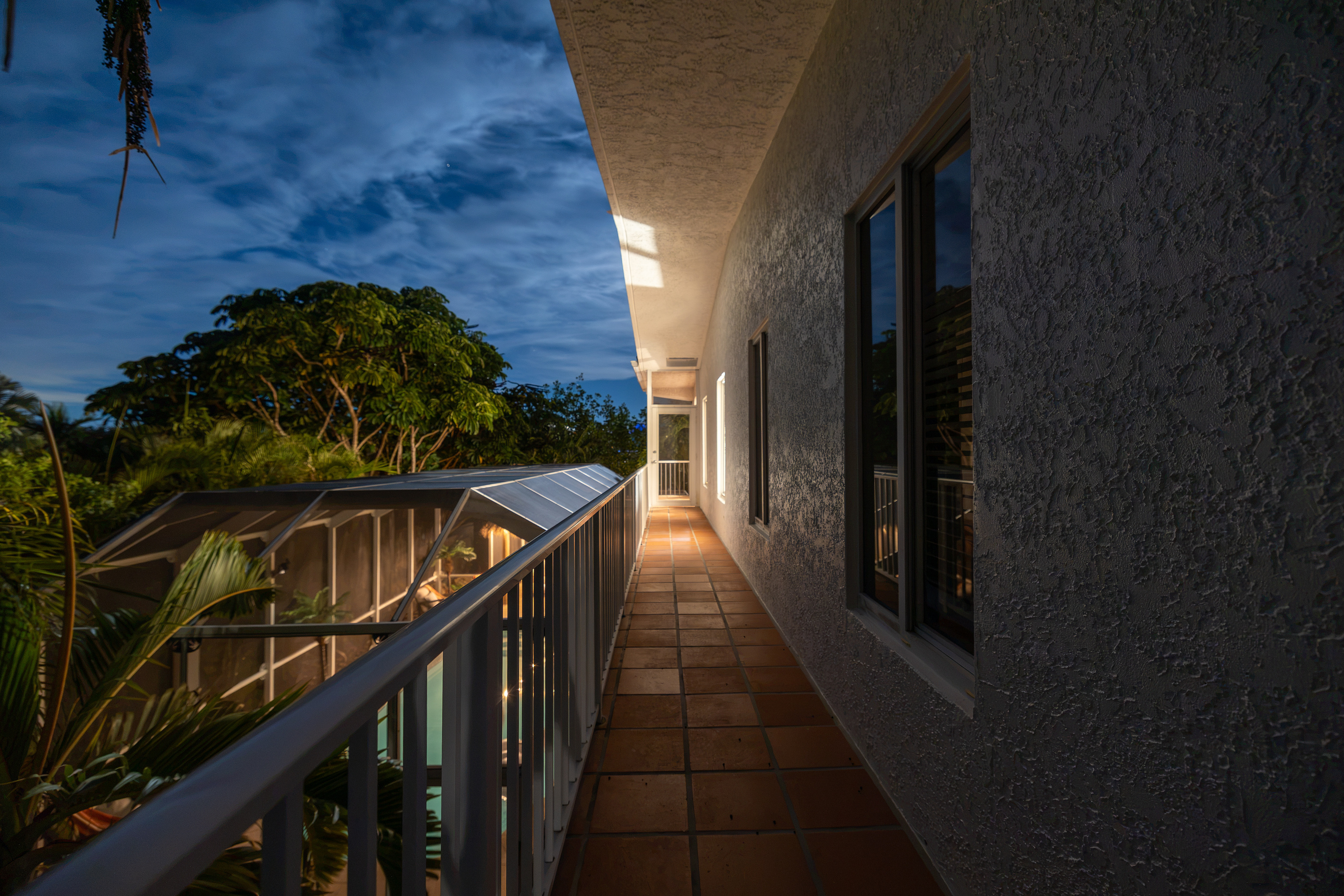 Coming down from the roof deck, there is a balcony that wraps around the entire second floor of the house.