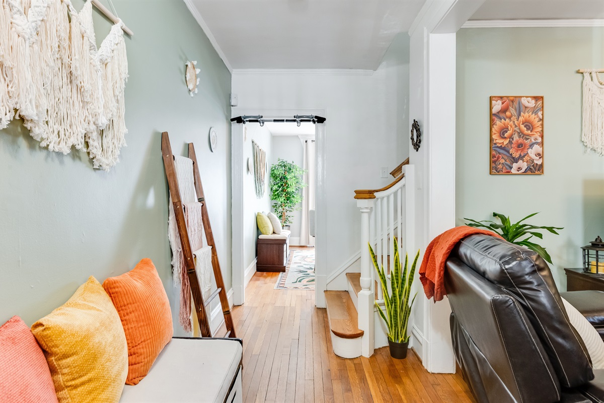 Welcoming Entryway: Bright decor, plush accents, and charming details invite you to explore!