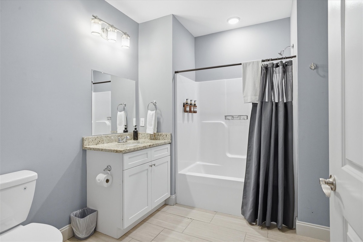 Everything you need, laid out simply—this bathroom in Unit 3 keeps things moving with a clean setup that works well when multiple people are sharing the space.