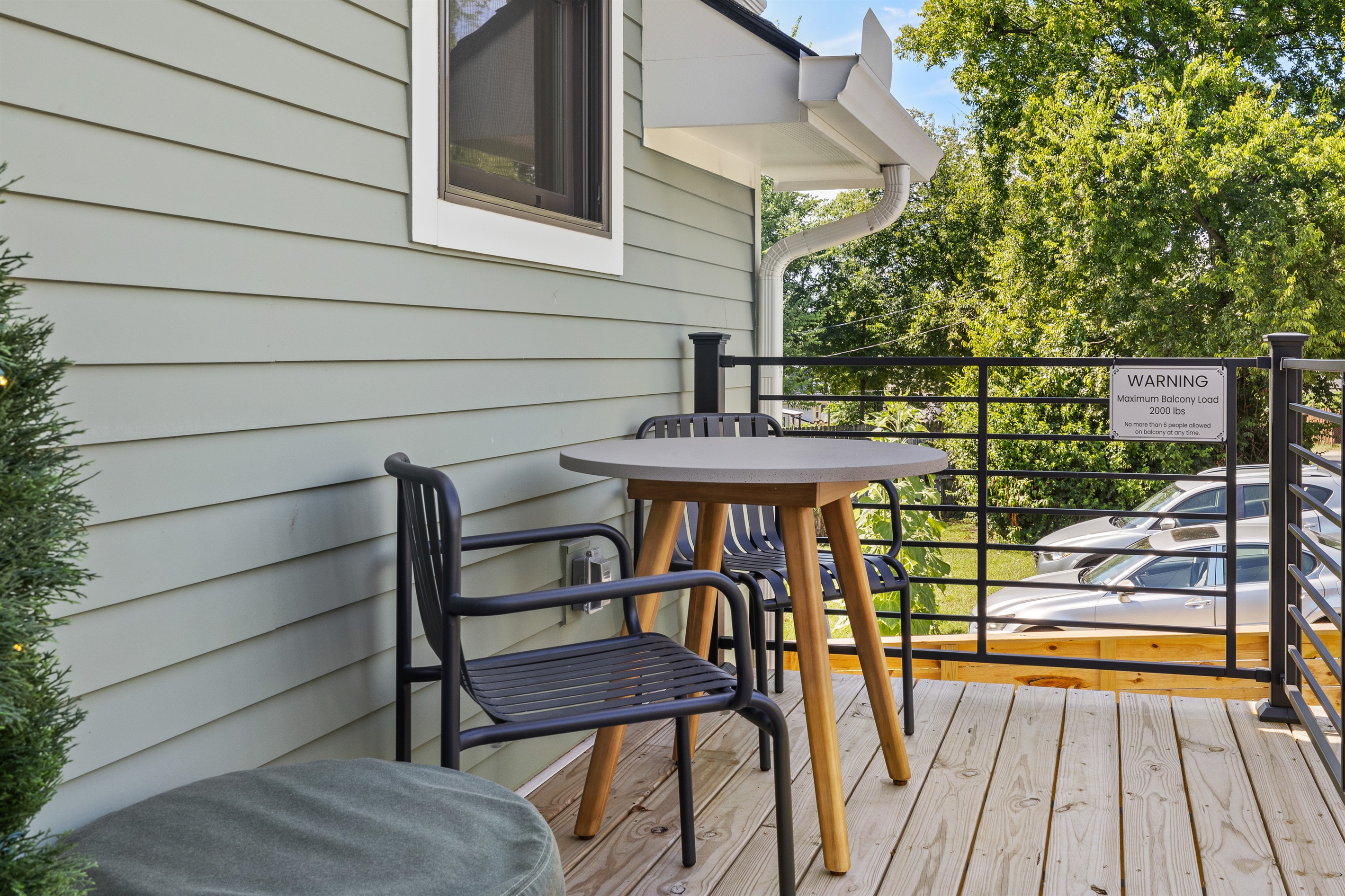 Balcony seating with café-style table and chairs for al fresco dining.