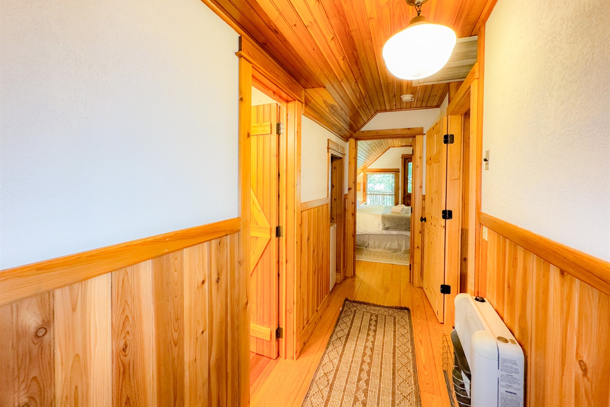 Hallway in the loft complete with a small refrigerator 