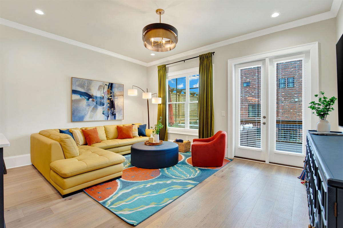 Living room with walk out to raised patio on 2nd floor