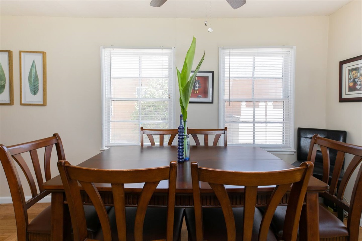 Mahogany dining table seats six guests.