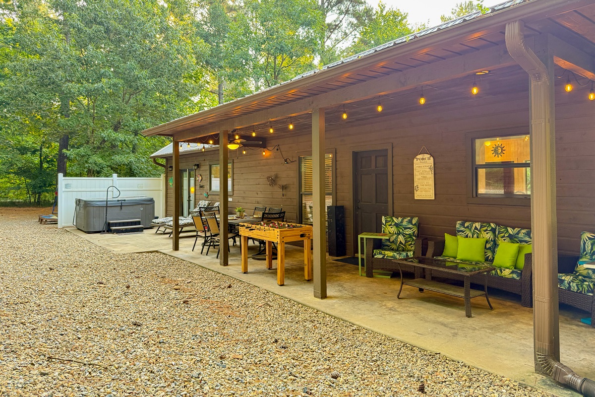 Dining, games, hot tub, and cozy seating&mdash;all under one roof. Rain or shine, you're covered!