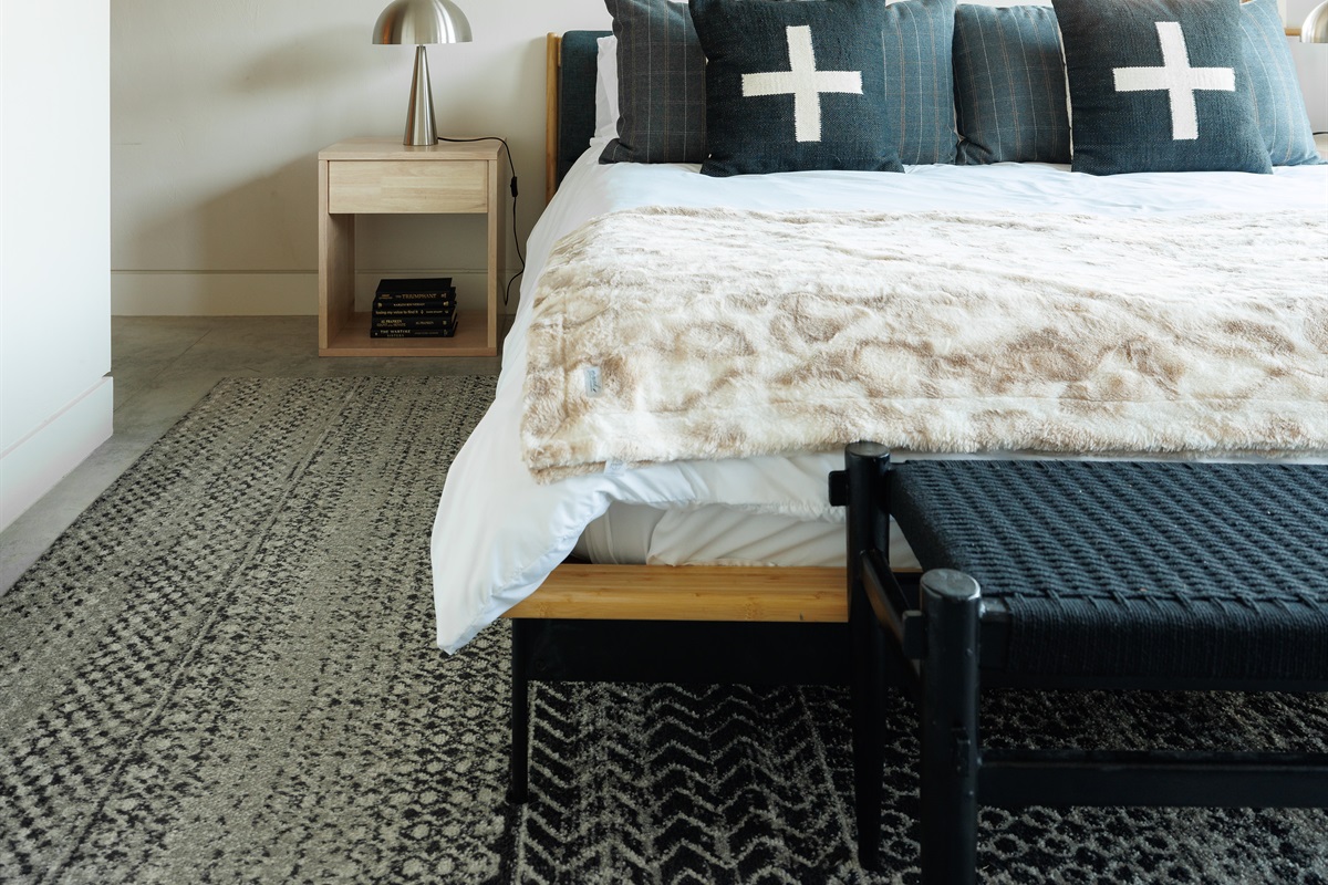 Primary bedroom seating and storage details