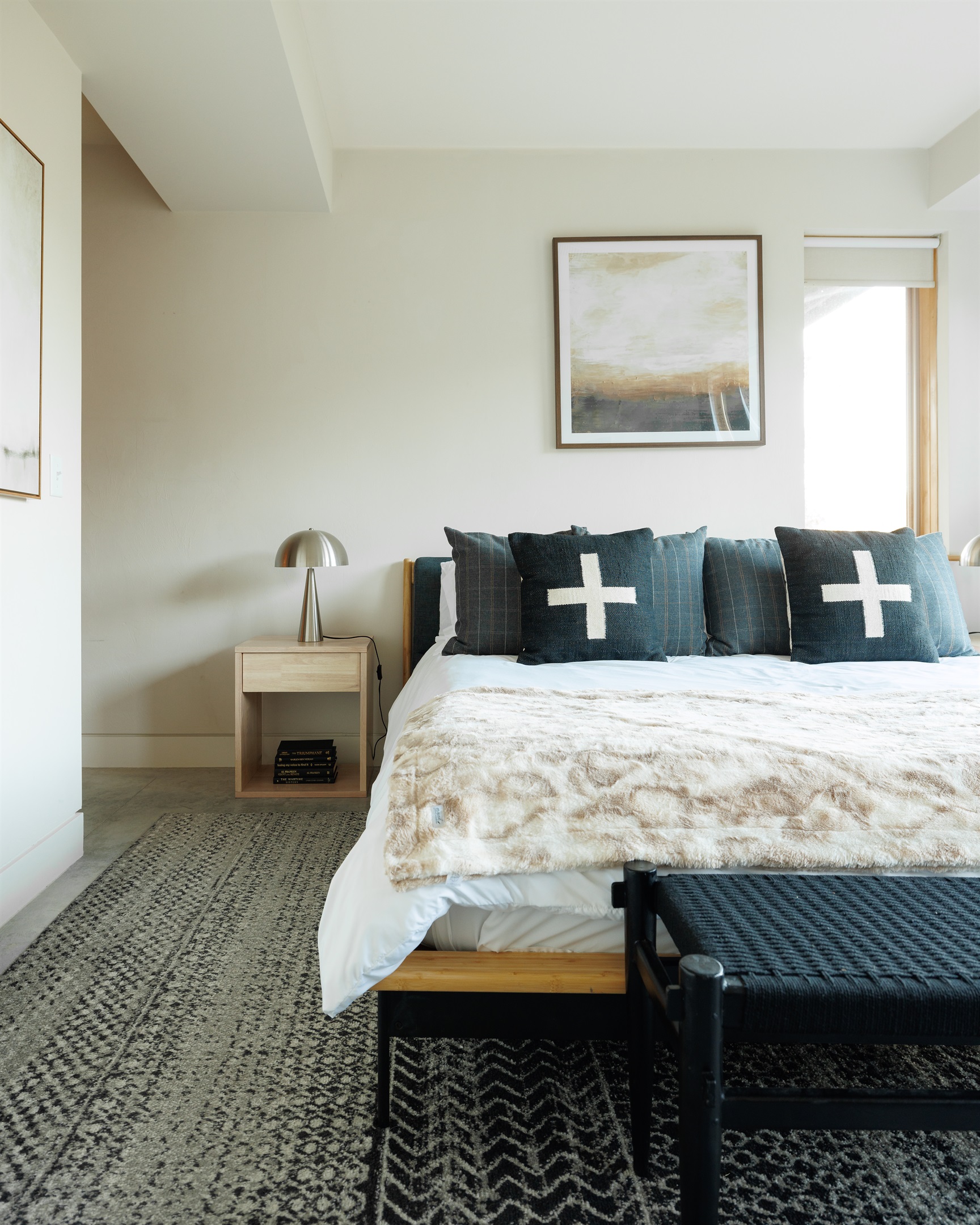 Primary bedroom seating and storage details