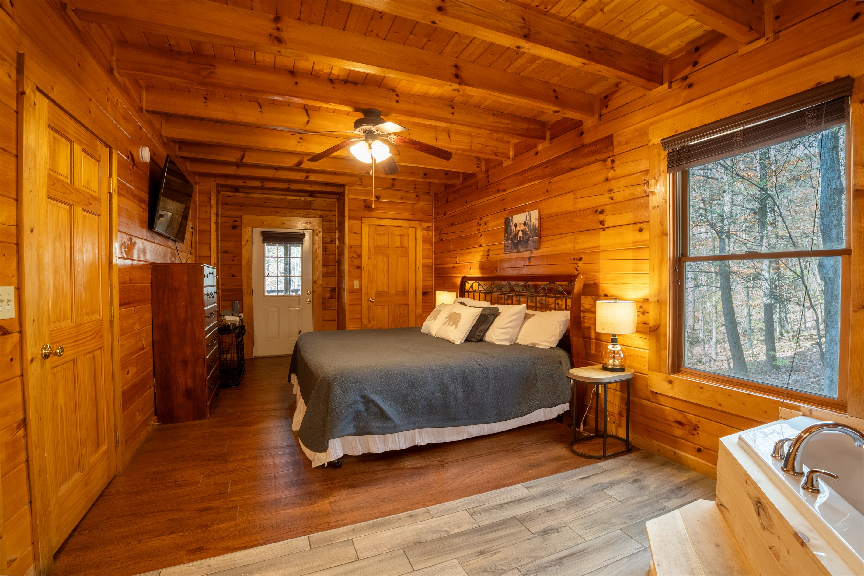 With private access to the back deck and space for your fur baby, you'll find this master bedroom private and spacious!